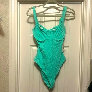 L*Space new with tags open back swimsuit. UNDERWIRE support. Will fit D cup.